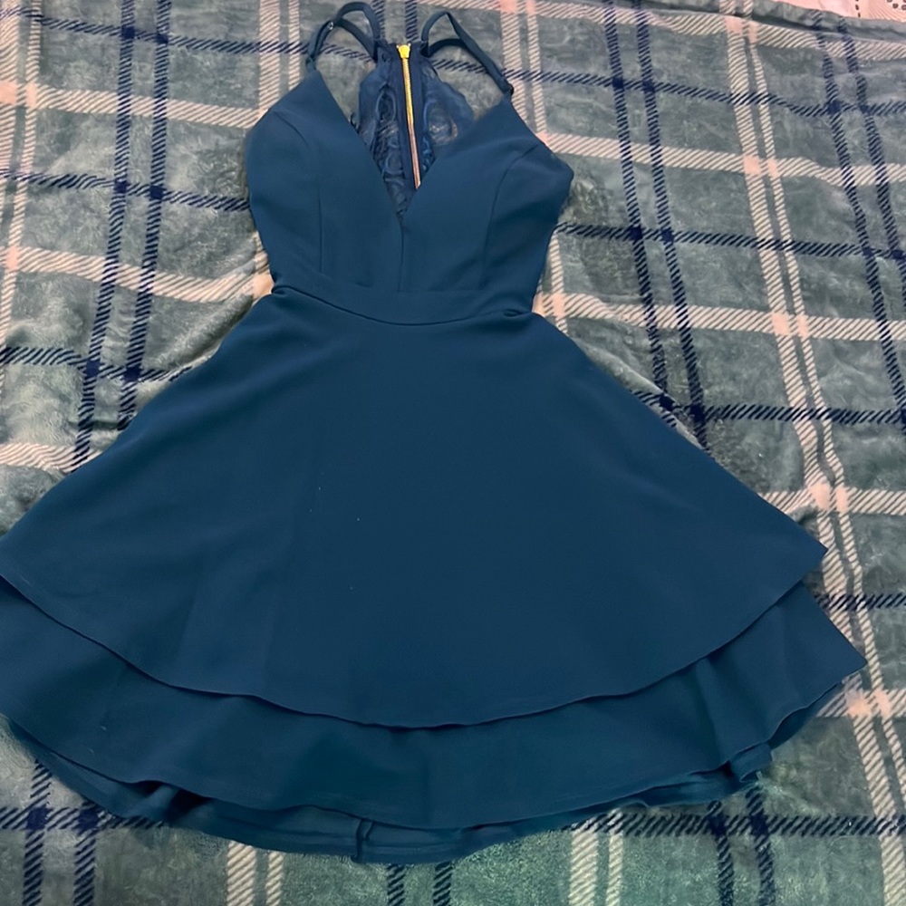 Honey and Rosie Size S. Dark blueish green.